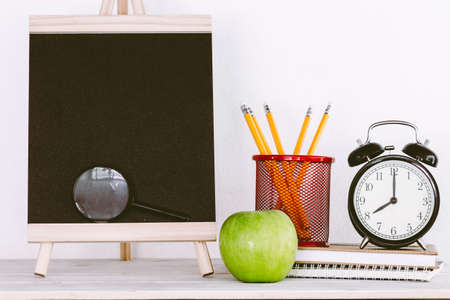 Chalkboard with school supplies
