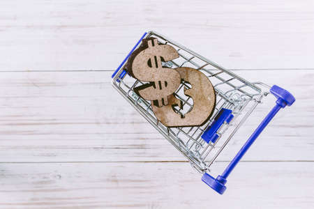 Supermarket cart with coin money