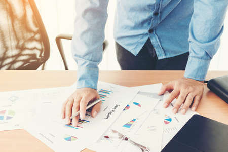 Businessman working and holding business graph informationの写真素材