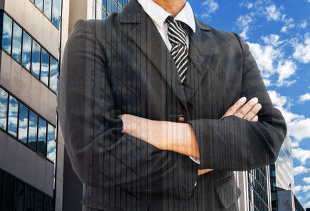  Businessman with Double exposure photo of Office buildings against blue skyの写真素材