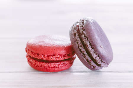 Macaroons on wooden tableの写真素材