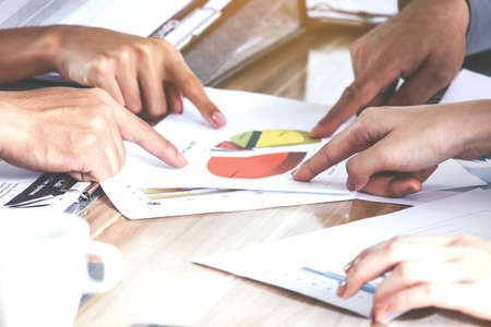 Business hand pointing at business document