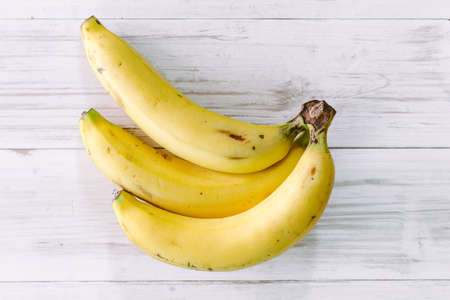 Bananas on wooden tableの写真素材