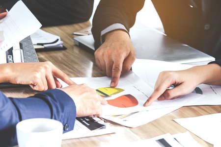 Business hand pointing at business document