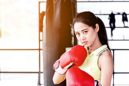 Female with red boxing glovesの写真素材