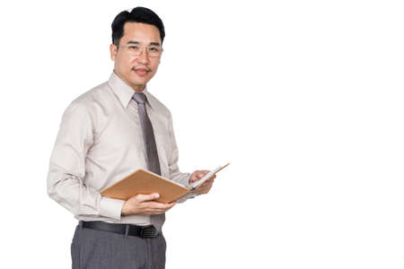 Businessman holding a book isolated on white backgroundの写真素材