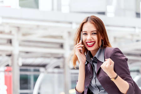 Portrait of businesswoman using smartphone の写真素材