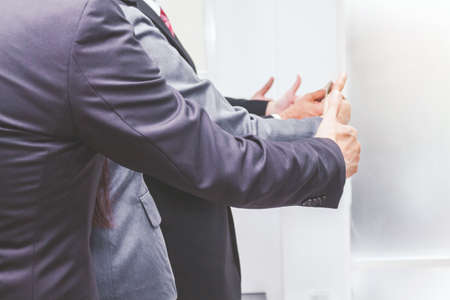 Business teamwork show thumb upの写真素材