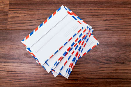 Letter envelopes on wooden backgroundの写真素材