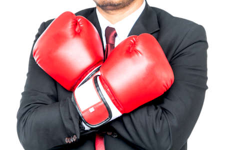 Businessman and boxing gloves isolated on white backgroundの写真素材