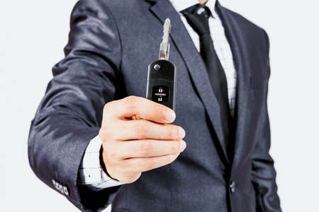 Businessman holding  car keys の写真素材