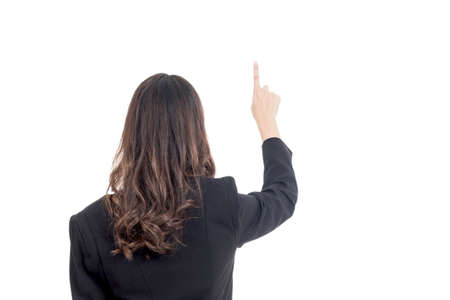 Business woman touching the screen with her finger isolated on whiteの写真素材