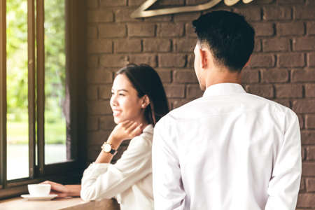 Happy asia couple at coffee shopの写真素材