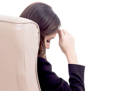 Young business woman sitting on chair isolated on white backgroundの写真素材