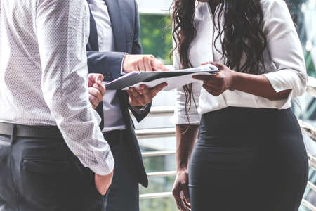 Group of businesspeople meeting together and discussing workの写真素材