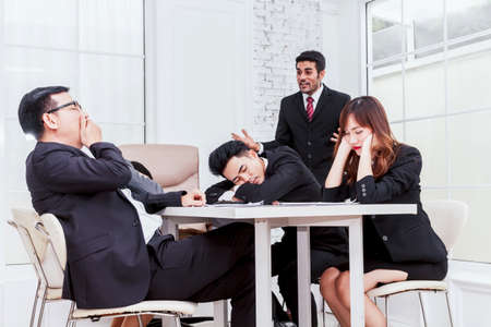 Group of business people sleeping at the meetingの写真素材