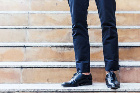 Businessman walking on the stairsの写真素材