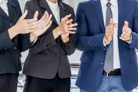 Business people clapping hands in the meetingの写真素材