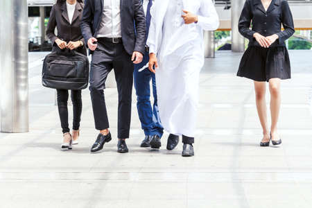 Group of business people walking at the streetの写真素材