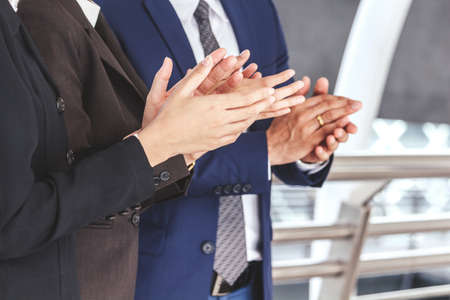 Business people clapping hands in the meetingの写真素材
