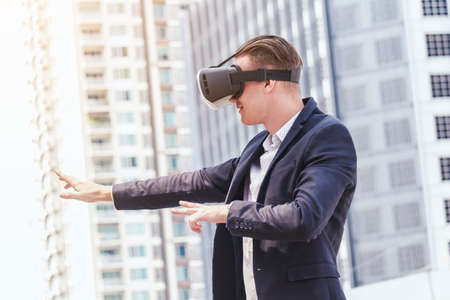 Young man enjoy with virtual reality glassesの写真素材