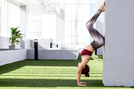 Woman practicing yoga in the park - Healthy lifestyleの写真素材