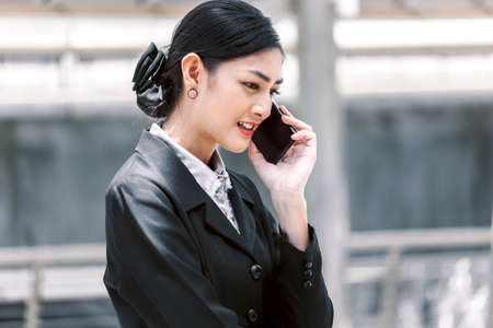 Portrait of businesswoman using smartphoneの写真素材