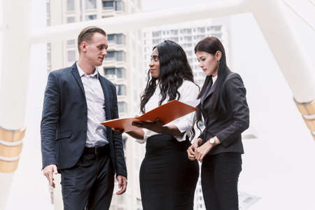 Group of business partners talking and working
