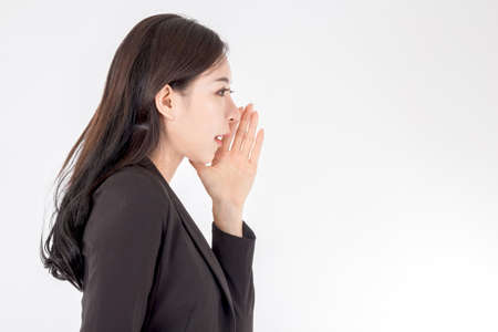 Woman whispering gossip on white background