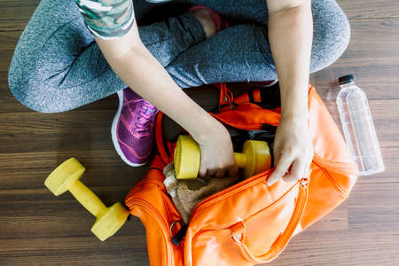 Woman with bag and fitness equipmentの写真素材