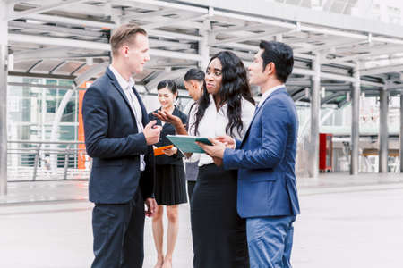 Group of business partners talking and workingの写真素材