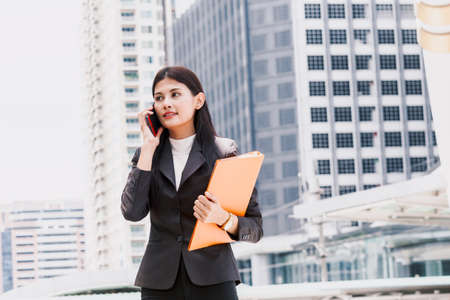 Portrait of businesswoman using smartphoneの写真素材