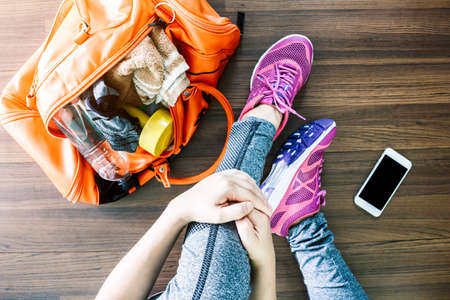 Woman with bag and fitness equipmentの写真素材