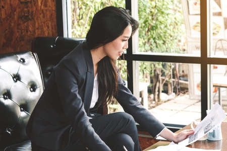Businesswoman working at a coffee shopの写真素材