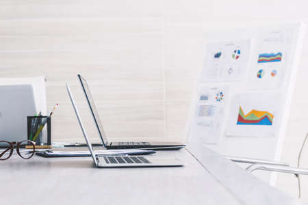 Business meeting and conference room with laptop and business document