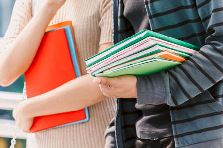 Group of students holding notebooks outdoors.Education conceptの写真素材
