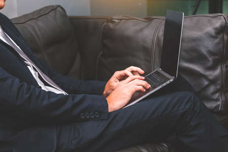 Businessman working with laptop computer at the officeの写真素材