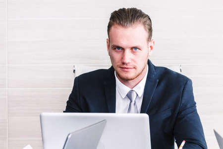 Businessman manager working on notebook computer and business document at office