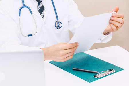 Doctor and stethoscope working with laptop computer in hospital.healthcare and medicineの写真素材