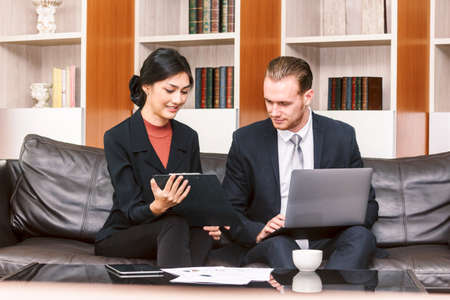 Image two business partners talking and working together