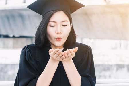 Happy woman students celebrating successful graduation