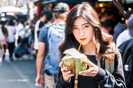 Asian woman tourist travel walk on the streetの写真素材