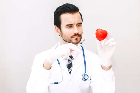 Doctor holding injection in hospital.healthcare and medicineの写真素材