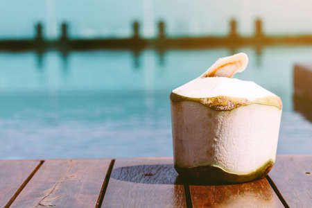 Coconut on swimming pool backgroundの写真素材