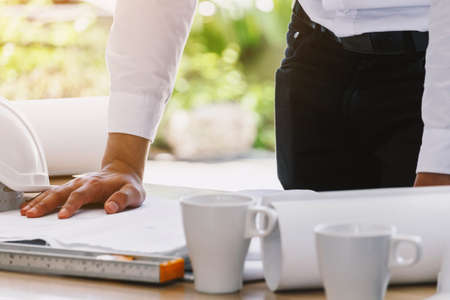 Architect working with construction tools on tableの写真素材