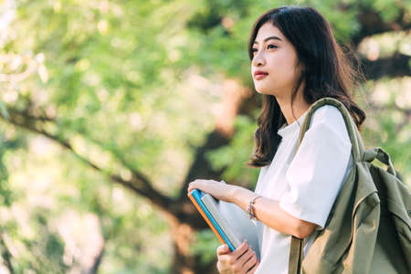 Woman students holding notebooks outdoors.Education conceptの写真素材