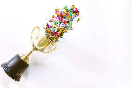Successful of golden trophy and colorful paper with copy space on white background.Successful conceptの写真素材