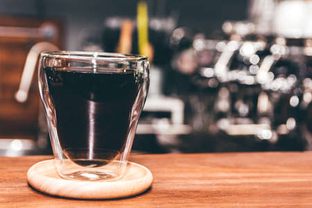 Coffee on wooden table in coffee shop
