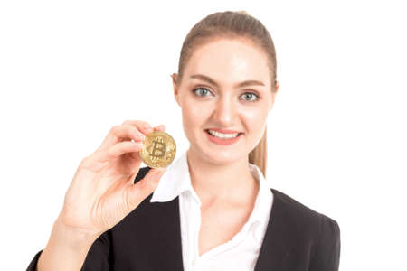 Businesswoman holding golden bitcoin in her hand isolated on white background