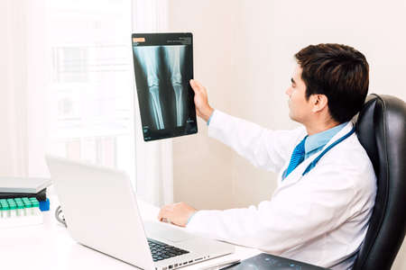 Doctor looking at x-ray photo in hospital.healthcare and medicine